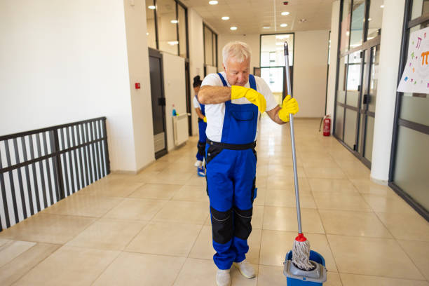 istock Janitors cleaning the  floor in school hallway 2165644655