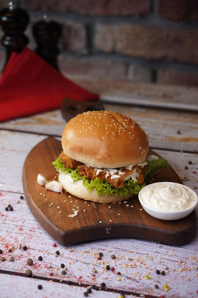 istock Delicious Chicken Burger with Spicy French Fries 2165645607