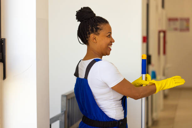 istock Female janitor cleaning the school building 2165646106