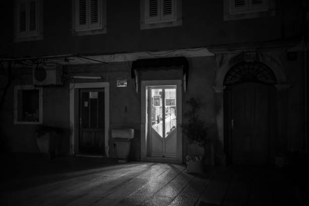 Cres, Croatia - October 23, 2022: Barbour shop in Cres in the night, black and white