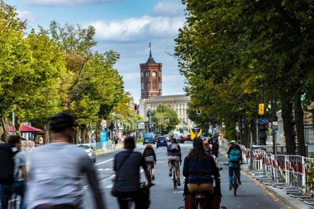 istock Cyclists in Berlin, red town hall in the background 2165647780