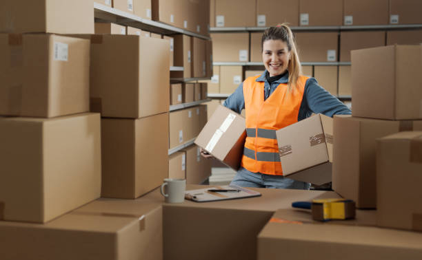 istock Portrait of a strong warehouse worker carrying boxes 2165649571