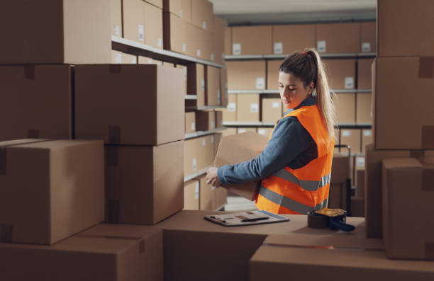 istock Woman working at the warehouse 2165650466