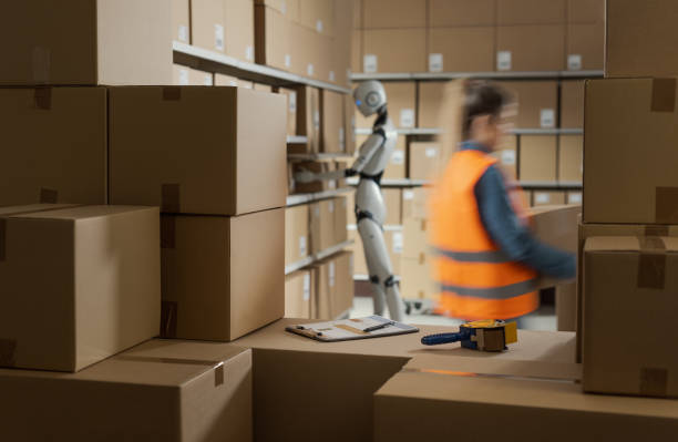 istock Warehouse worker and AI robot working together 2165650505