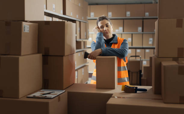 istock Tired depressed woman working in a warehouse 2165650594