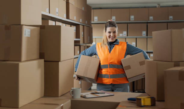 istock Portrait of a strong warehouse worker carrying boxes 2165650652