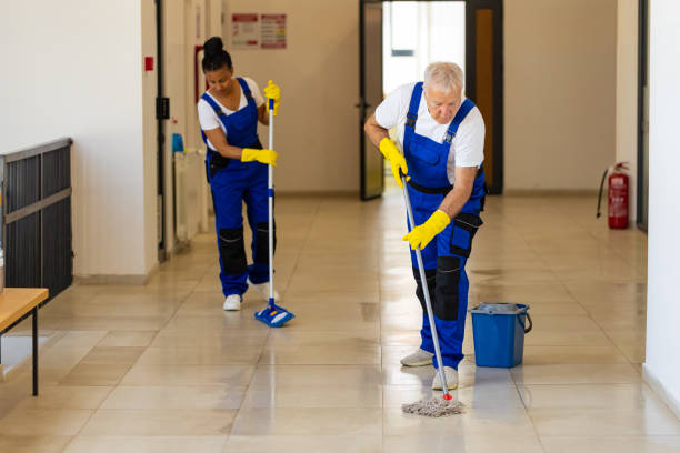 istock Hardworking Janitors cleaning the  floor in school hallway 2165650701