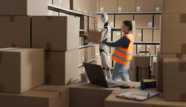 istock Human-robot cooperation at work in the warehouse 2165650788
