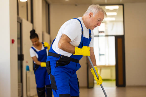 istock Hardworking Janitors cleaning the  floor in school hallway 2165651651