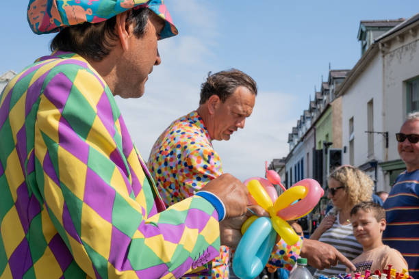 Ballycastle, UK - August 30th, 2022: Balloon animals made on demand by men in colourful costumes, entertainments at the Ould Lammas Fair.