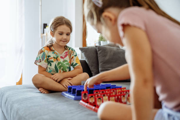 Preschool sisters spending time together during summer holidays