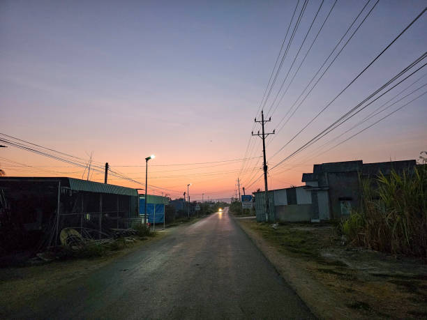istock Dawn on the asphalt road with electric poles 2165658178
