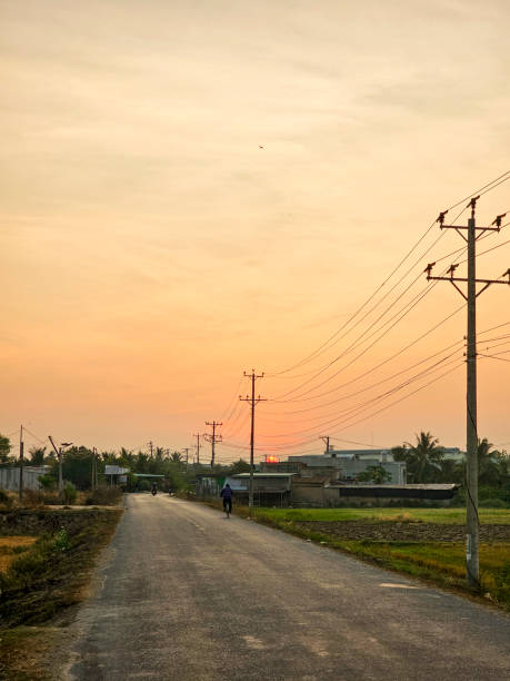 istock Dawn on the asphalt road with electric poles 2165658194