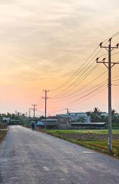 istock Dawn on the asphalt road with electric poles 2165658204