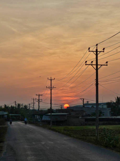 istock Dawn on the asphalt road with electric poles 2165658215