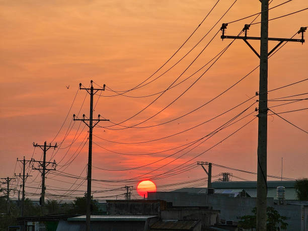 Dawn on the asphalt road with electric poles