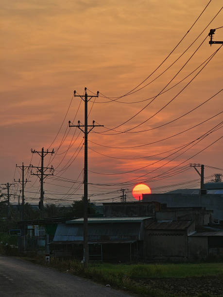 istock Dawn on the asphalt road with electric poles 2165658221