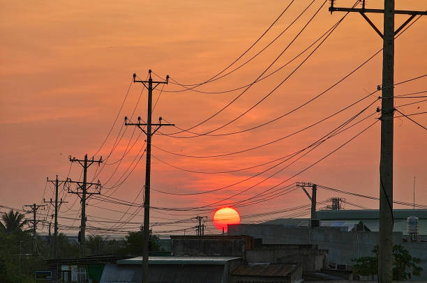 istock Dawn on the asphalt road with electric poles 2165658238