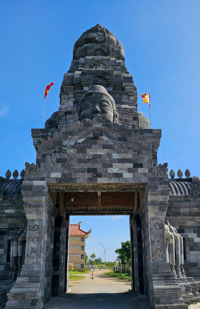 istock Buddha statue carved on the temple gate 2165658877