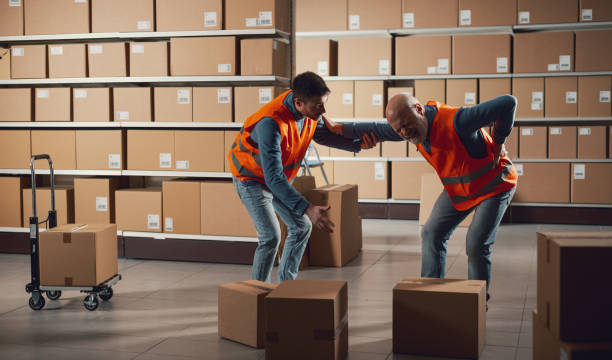 istock Worker helping an injured colleage 2165661259