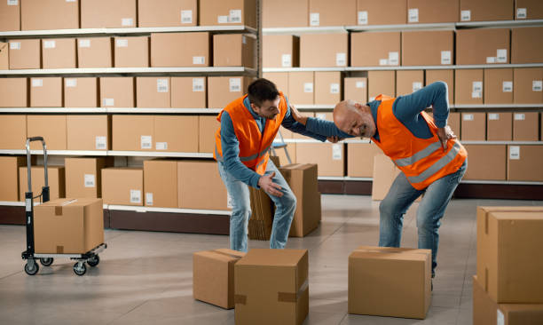 istock Worker helping an injured colleage 2165661362