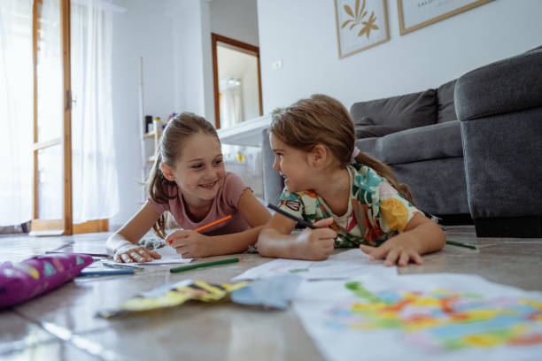 istock Preschool sisters drawing and doing creative activities in summer 2165661983