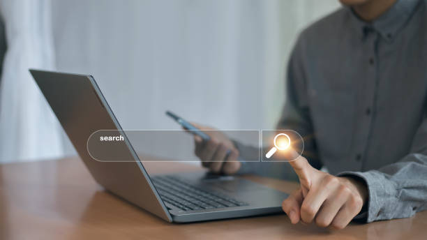 istock Searching the internet with a search bar working on a smartphone, internet network concept. 2165665851
