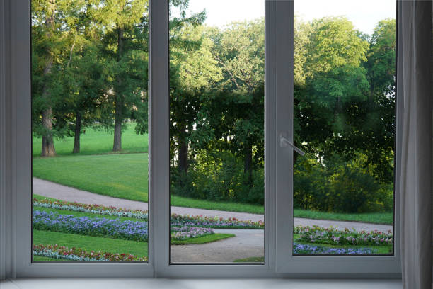 istock View from the window, green trees, landscape with flower. 2165667803