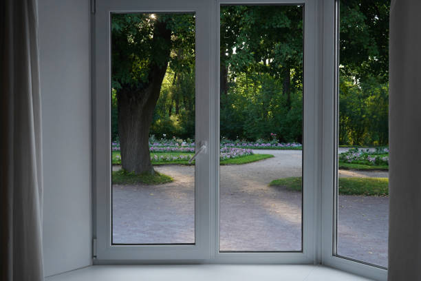 istock View from the window, green trees, landscape with flower. 2165667821