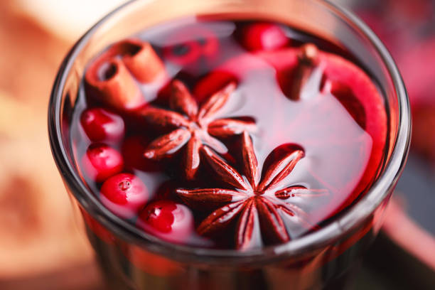 istock Red mulled wine in glass with cinnamon sticks 2165668343