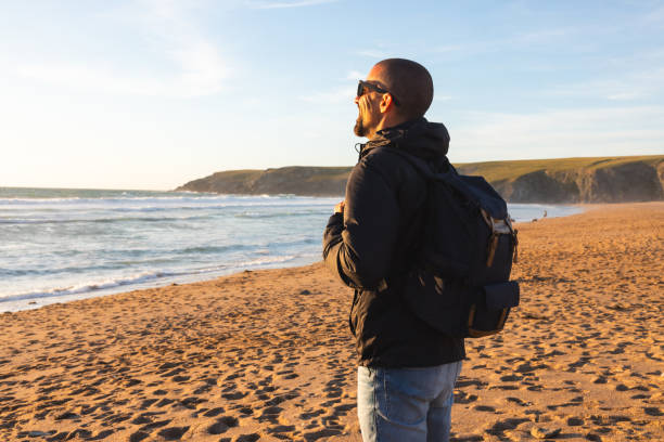 Man alone at seaside looking at view