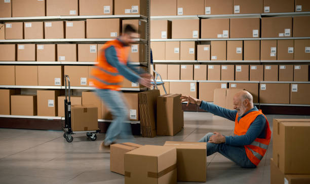 istock Worker helping an injured colleague 2165672230
