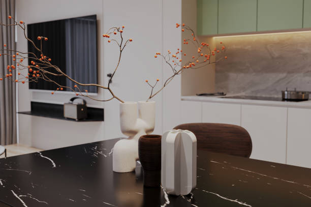 istock Modern dining room with an black marble table and flower vase on it 2165672317