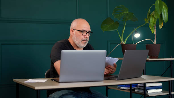 istock A professional male programmer brainstorms in a modern office. Perfect for themes of innovation, tech development, and collaborative problem-solving. 2165673973