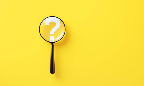 istock Black Magnifier And White Question Mark On Yellow Background 2165679083