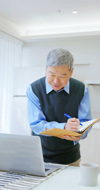 istock asian old businessman use laptop 2165679928