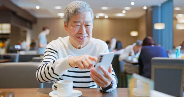 istock senior man use smart phone 2165680010