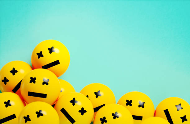 Yellow spheres textured with neutral face emoji on blue background. Horizontal composition.