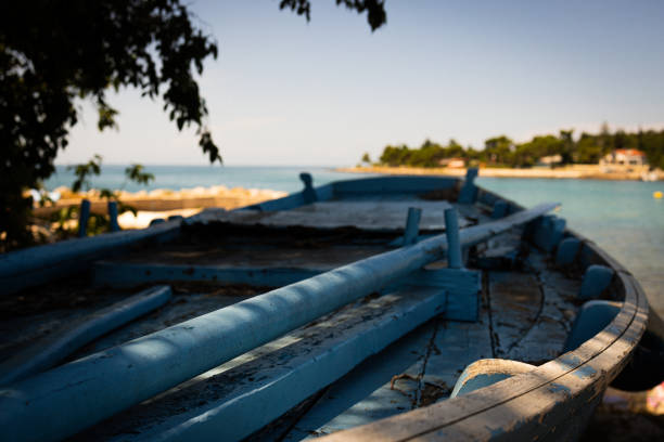 Old blue boat parked on  a mediterranean coastline