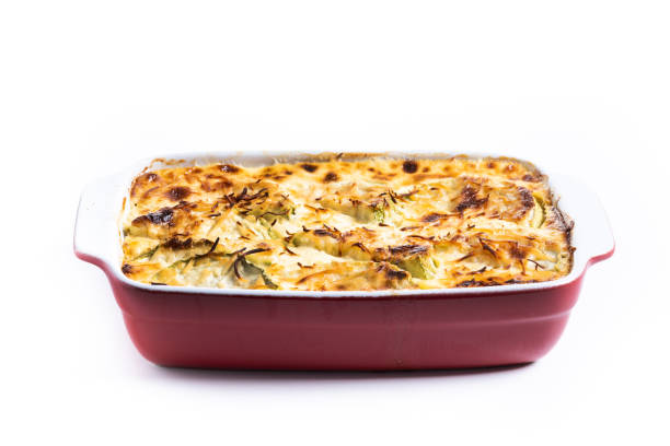 Casserole with cheese and gratin zucchini isolated on white background.