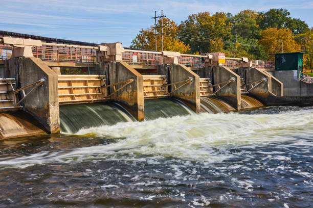 istock Autumnal Trees and Flowing Dam Water at Huron River, Eye-Level View 2165686551