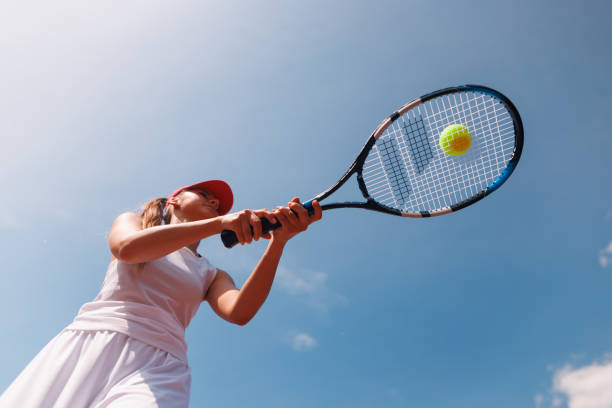 istock young tennis player playing tennis, bottom view 2165688377