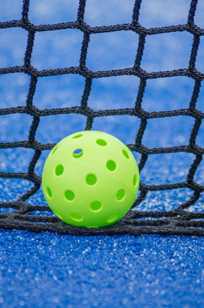 istock isolated pickleball ball near net with blurred background 2165688458