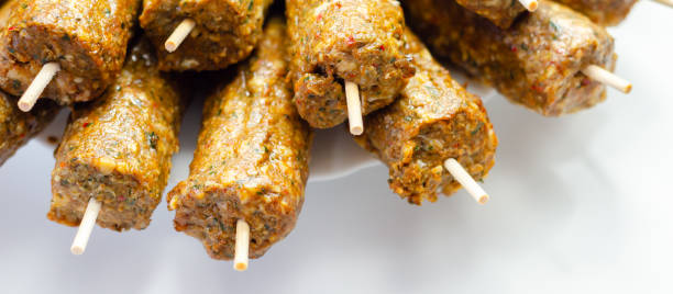 istock A bunch of skewers with meat on them 2165694200