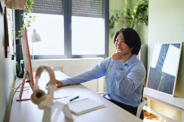 istock Happy multiracial man working from home 2165697542