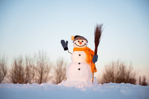 istock Funny snowman in knitted hat 2165697915