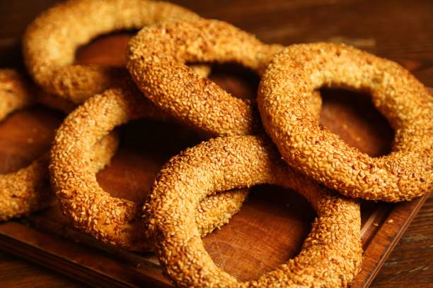 istock Sesame Seed Bread Rings on Wooden Board 2165702759