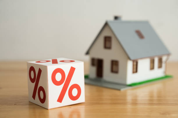 istock Blocks percentage sign with house model background. 2165703982