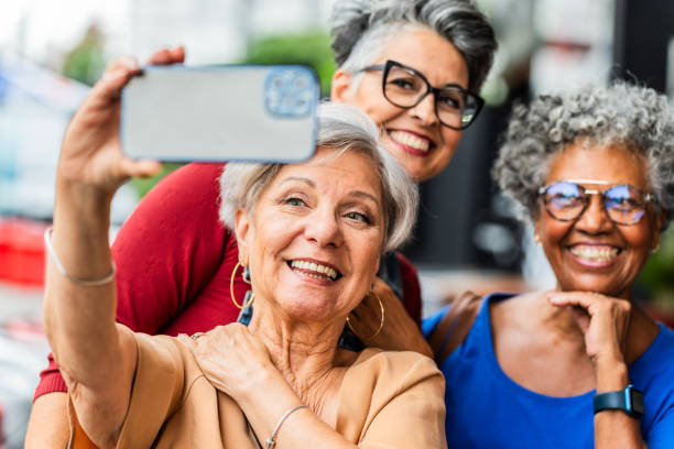istock Female senior friends taking a selfie 2165711671