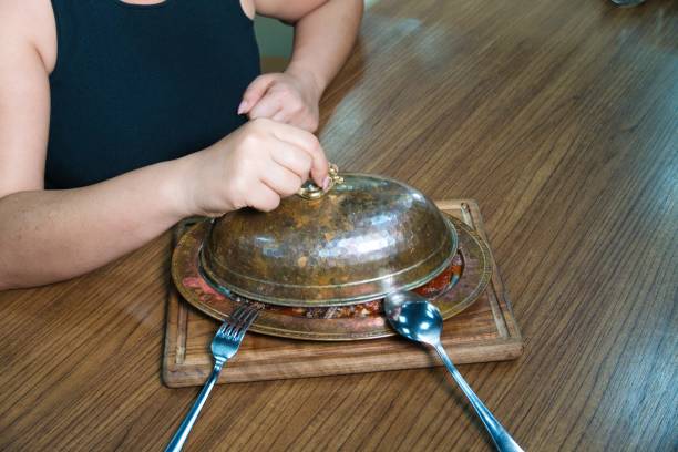 Copper cezves, traditional Turkish coffee pots, are elegantly displayed, highlighting the craftsmanship and cultural significance of Turkish coffee. The scene captures the essence of tradition and craftsmanship in every detail.